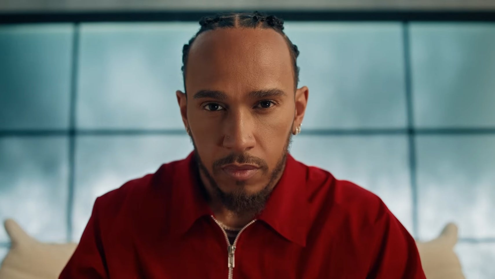 Close up of racing driver Lewis Hamilton from F1 25 official trailer